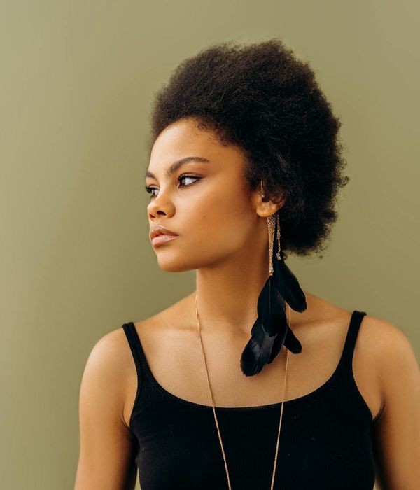 Woman in a graceful yoga pose, finding balance and energy.